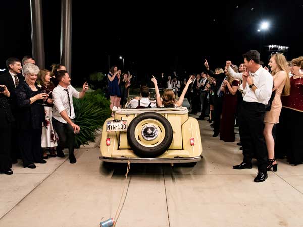 Bride and Groom in a vintage car.