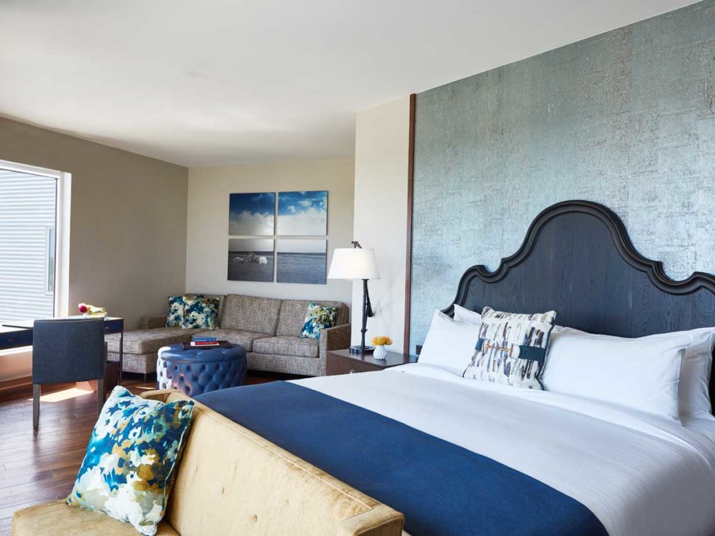 Guestroom bed with sitting area.