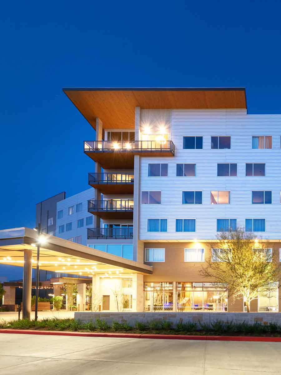 The Stella Hotel exterior view at night.