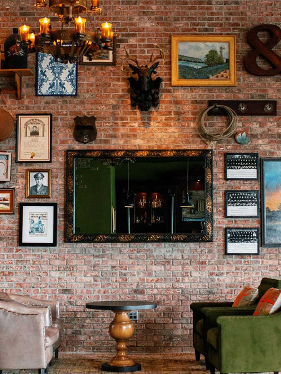 A sitting area next to a brick wall.
