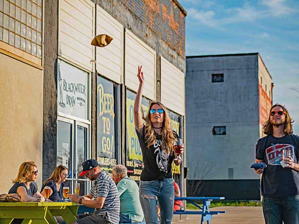 Group Playing Corn Hole.